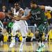 Michigan junior Tim Hardaway Jr. moves the ball around Cleveland State sophomore Sebastian Douglas during the first half of an NIT Season Tip-Off game at Crisler Center on Tuesday. Melanie Maxwell I AnnArbor.com